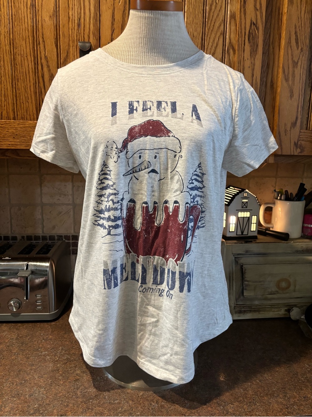 Maurices Cream Graphic Holiday Snowman Tee with Red and Blue Print
